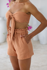 Womens super soft, 100% cotton high waited Paperbag shorts in brick, featuring an elasticated waist with a belt and side pockets