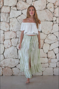 Womens tie dye skirt in green featuring a smocked waist and button down front closing