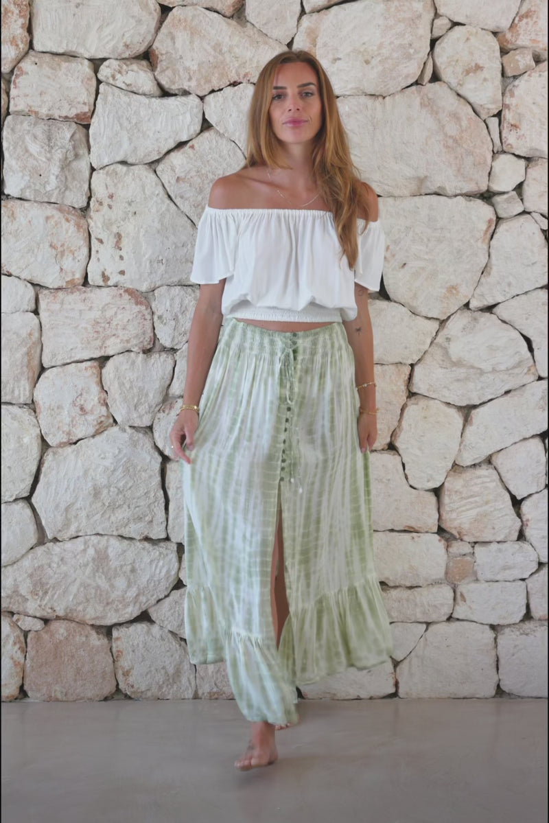 Womens tie dye skirt in green featuring a smocked waist and button down front closing