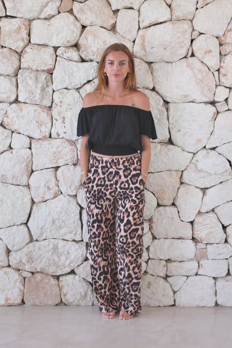 Womens trousers in big leopard print featuring an elasticated waist and pockets 