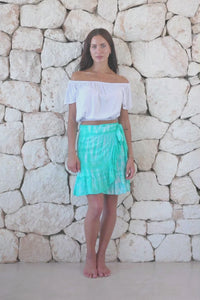 Womens short length tie dye wrap skirt in aqua blue featuring a self tie fastening and ruffle detail