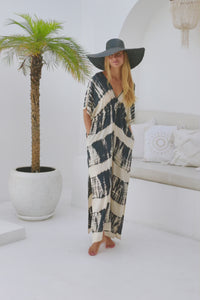 womens oversize maxi length tie dye kaftan in black and cream featuring a hand beaded neckline, pull tie detail and side pockets

