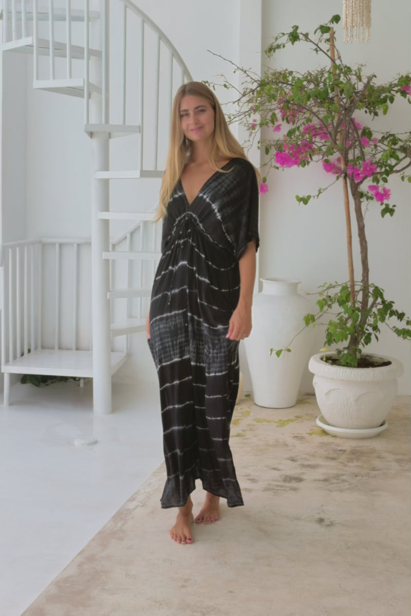 womens oversize maxi length tie dye kaftan in ink black and featuring a hand beaded neckline, pull tie detail and side pockets

