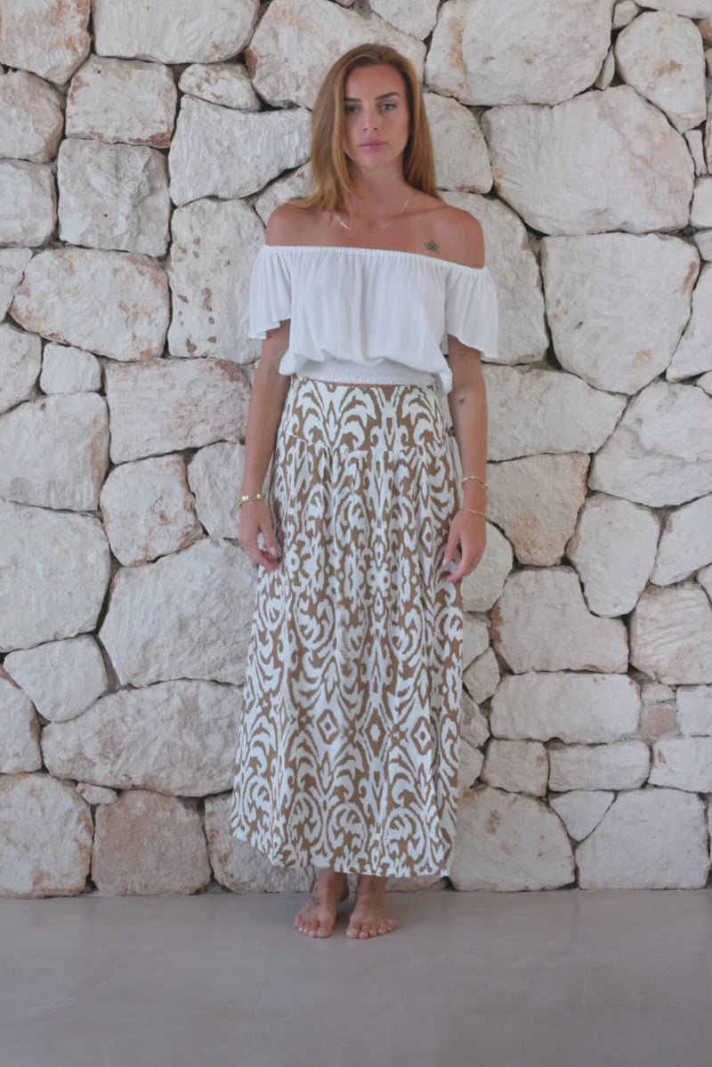 Womens stylish, lightweight and super soft long length skirt in brown and cream savannah ptint featuring an elasticated waist at the back and front/side split