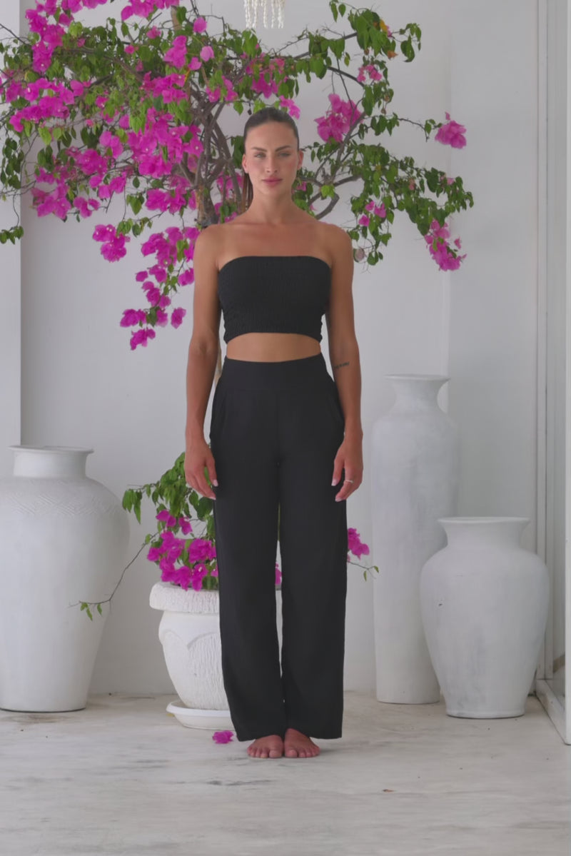 Womens stylish, super soft 100% cotton Rachel Trousers in black, featuring an elasticated waist and pockets for a flattering and comfortable fit