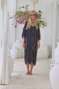womens mid length oversize tie dye dress in navy blue and brown featuring a hand beaded v neckline, 3/4 length sleeves and pockets