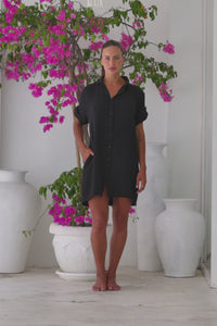 Womens super soft, 100% cotton Riley Shirt Dress in black with button down fastening, side pockets and 3/4 length sleeves with turn-up detail 