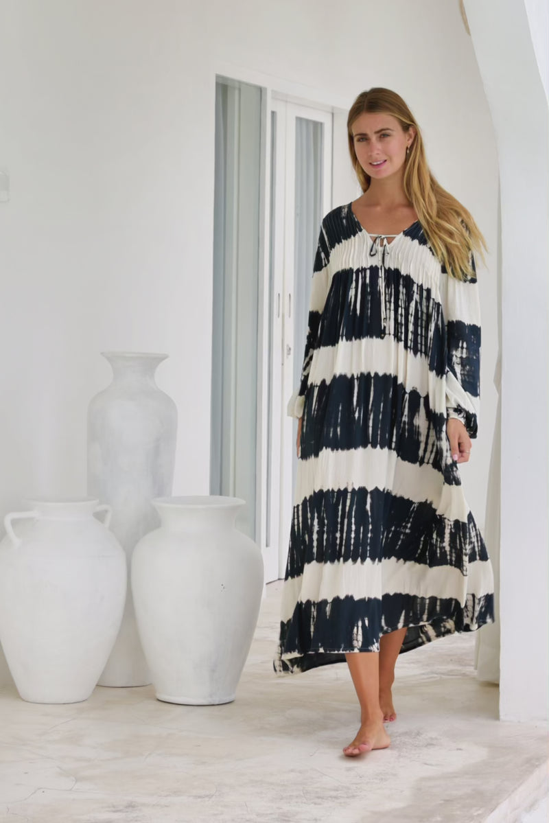 tie dye oversize dress in black and cream featuring tie detail, side pockets and long sleeves