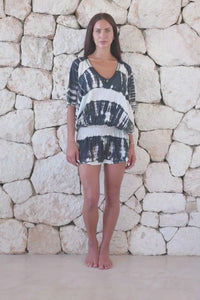 Womens stylish, super soft, lightweight, short length kaftan tie dye dress in black and cream featuring an elasticated waist and hand beaded v neckline