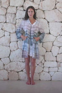 Womens short length tie dye tunic dress in light grey featuring a tiered silhouette, 3/4 length sleeves and pockets 