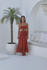 Womens super soft, comfortable and flattering Lorena Skirt in terracotta featuring a smocked waist and button down front closing