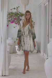 womens mid length tie dye tiered tunic dress in khaki and cream featuring a v neckline, long sleeves and side pockets