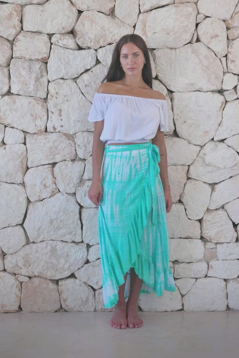 Womens long length tie dye wrap skirt in aqua blue featuring a self tie fastening and ruffle detail