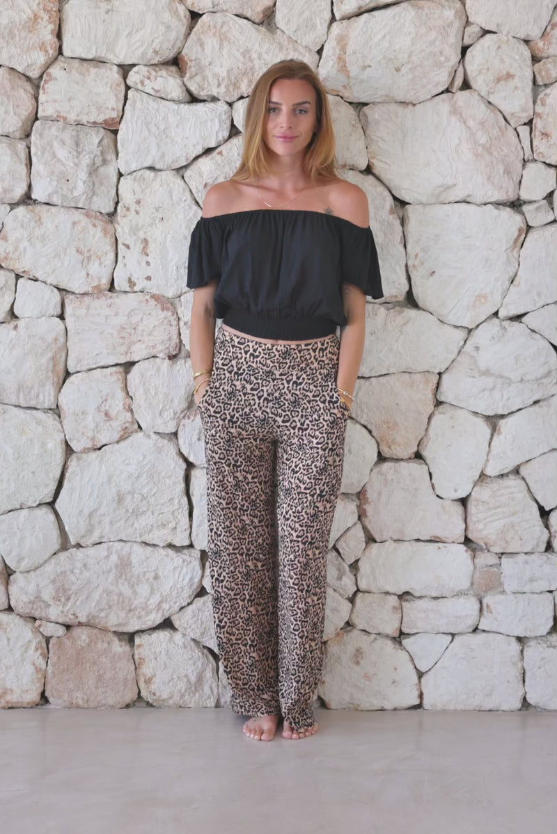Womens trousers in leopard print featuring an elasticated waist and pockets 