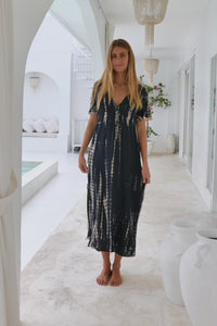 womens full length tie dye summer dress in black featuring a hand beaded v neckline, pull ties under the bust, short sleeves, pockets and side splits
