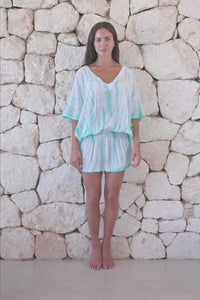 Womens stylish, super soft, lightweight, short length kaftan tie dye dress in aqua blue featuring an elasticated waist and hand beaded v neckline
