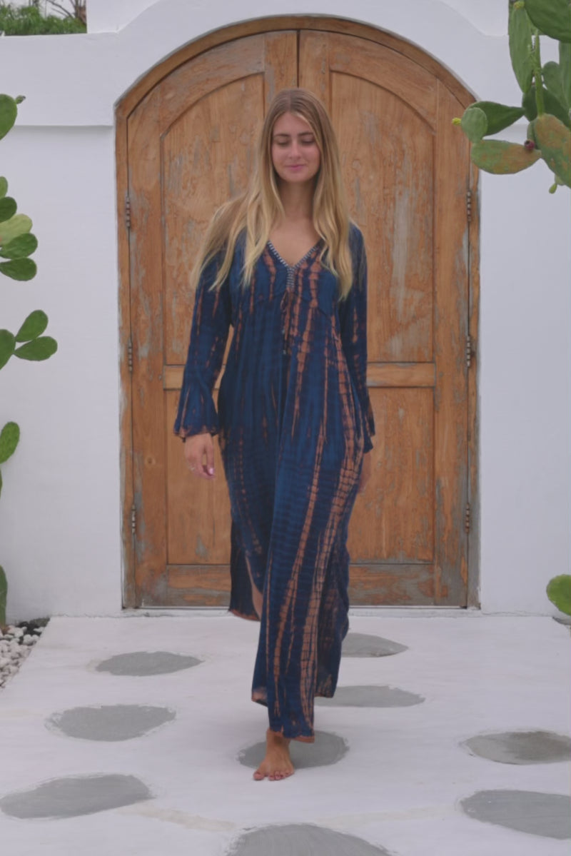 womens full length tie dye summer dress in black featuring a hand beaded v neckline, pull ties under the bust, trumpet sleeves, pockets and side splits