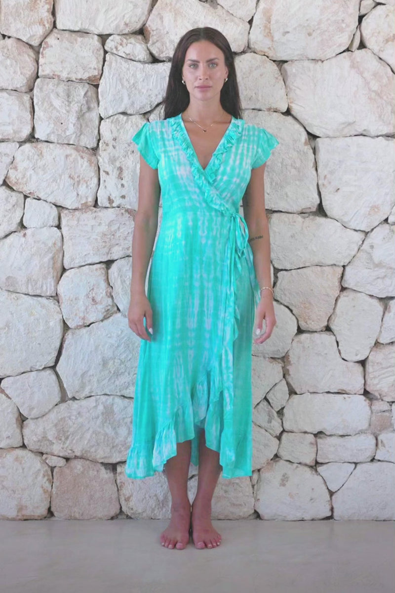 Womens super soft, lightweight, midi length tie dye dress in aqua blue featuring a ruffle detail and self tie fastening 