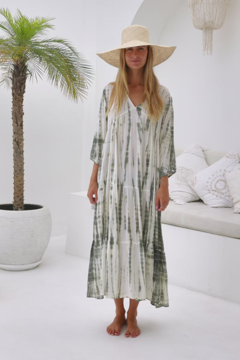 womens mid length tie dye tiered tunic dress in khaki and cream featuring a v neckline, long sleeves and side pockets