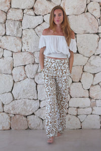 Womens trousers in brown and cream savannah print featuring an elasticated waist and pockets