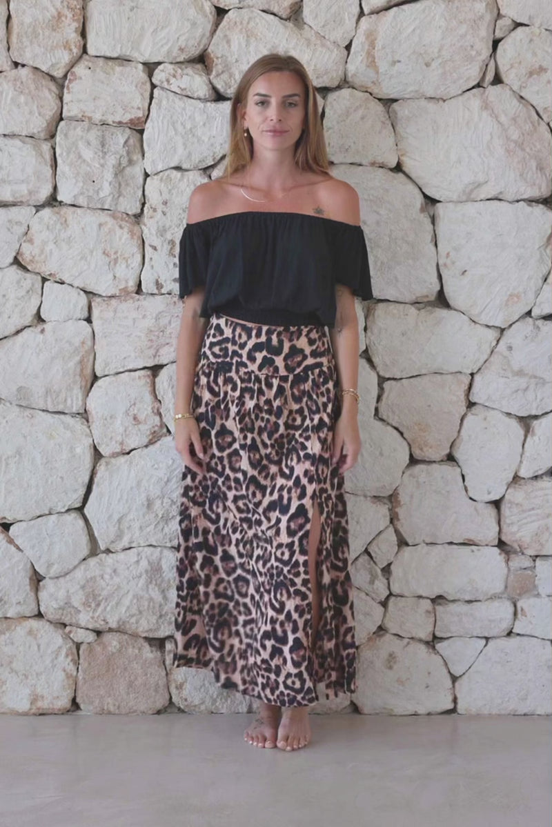 Womens stylish, lightweight and super soft long length skirt in big leopard print featuring an elasticated waist at the back and front/side split