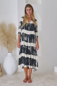 Womens button up mid length tie dye dress in black and cream featuring a tiered silhouette, 3/4 length sleeves and pockets 