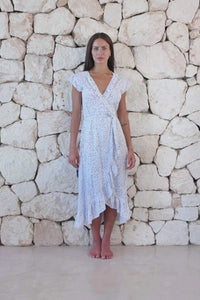 Womens stylish midi length tie dye dress in white polka dot featuring a ruffle detail and self tie fastening 