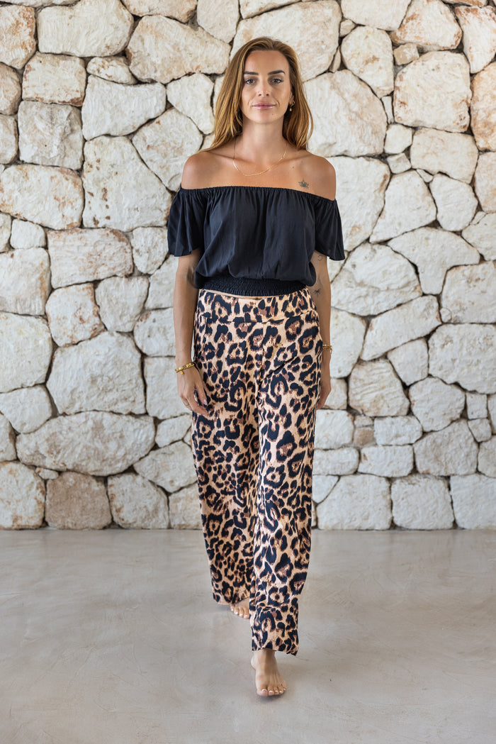 Womens trousers in big leopard print featuring an elasticated waist and pockets 