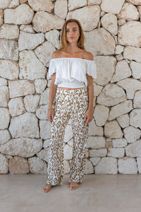 Womens trousers in brown and cream savannah print featuring an elasticated waist and pockets 