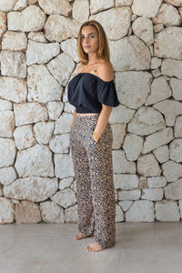 Womens trousers in leopard print featuring an elasticated waist and pockets 