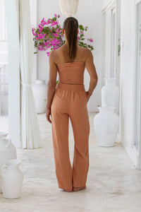 Womens stylish, super soft 100% cotton Rachel Trousers in brick, featuring an elasticated waist and pockets for a flattering and comfortable fit
