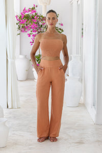 Womens stylish, super soft 100% cotton Rachel Trousers in brick, featuring an elasticated waist and pockets for a flattering and comfortable fit