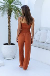 Womens stylish, super soft 100% cotton Rachel Trousers in terracotta, featuring an elasticated waist and pockets for a flattering and comfortable fit