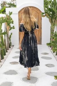 womens mid length tie dye dress in black featuring an off the shoulder frill, elasticated waist, detachable belt and side pockets