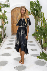 womens mid length tie dye dress in black featuring an off the shoulder frill, elasticated waist, detachable belt and side pockets