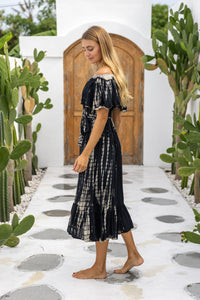 womens mid length tie dye dress in black featuring an off the shoulder frill, elasticated waist, detachable belt and side pockets