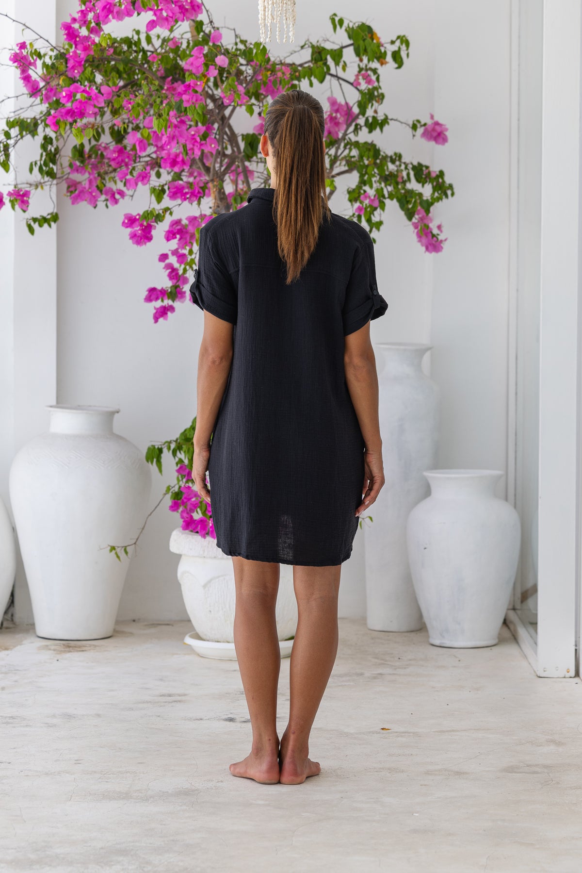 Womens super soft, 100% cotton Riley Shirt Dress in black with button down fastening, side pockets and 3/4 length sleeves with turn-up detail 