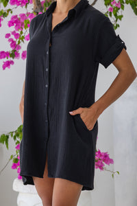 Womens super soft, 100% cotton Riley Shirt Dress in black with button down fastening, side pockets and 3/4 length sleeves with turn-up detail 