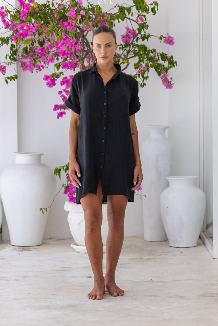 Womens super soft, 100% cotton Riley Shirt Dress in black with button down fastening, side pockets and 3/4 length sleeves with turn-up detail 
