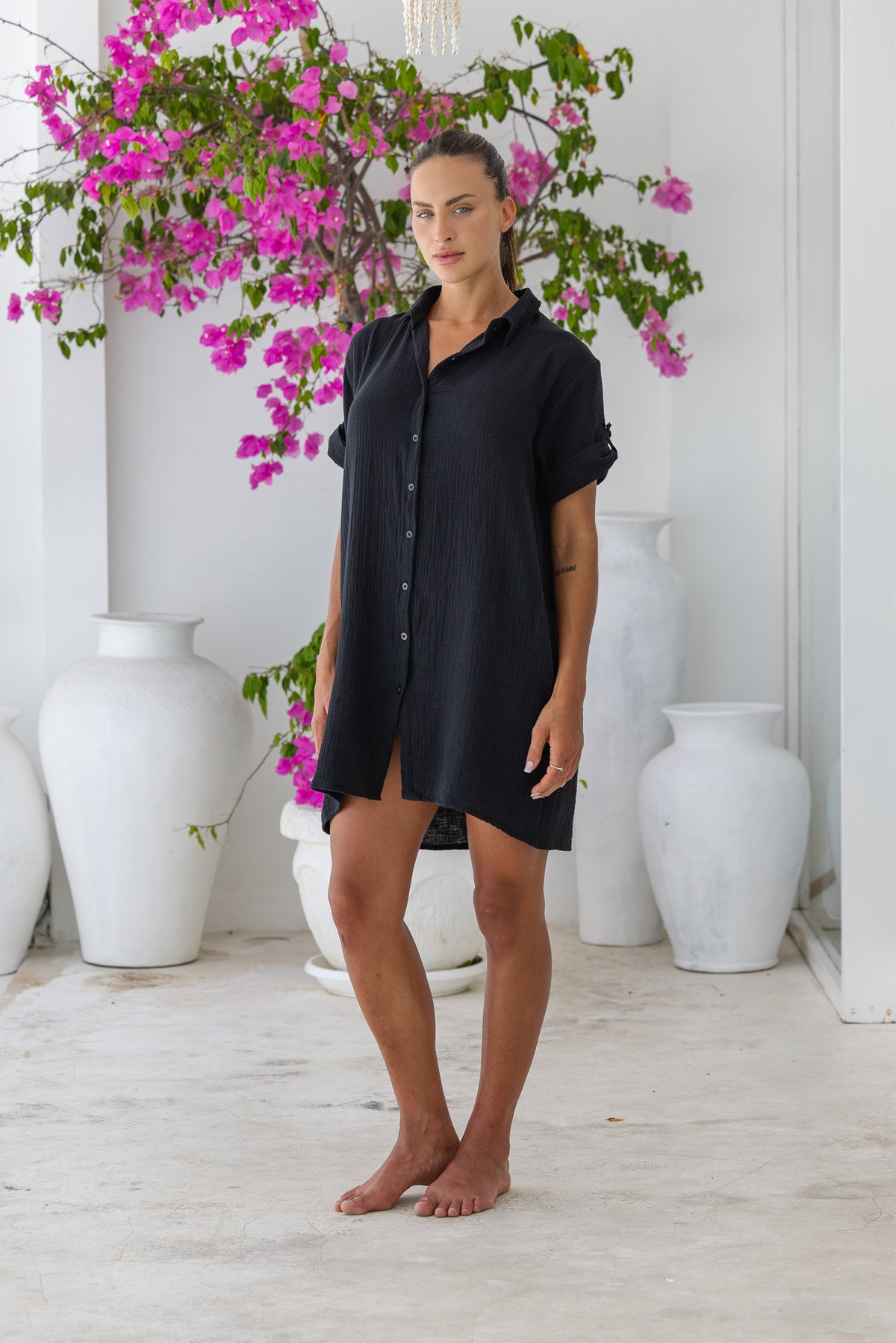 Womens super soft, 100% cotton Riley Shirt Dress in black with button down fastening, side pockets and 3/4 length sleeves with turn-up detail 