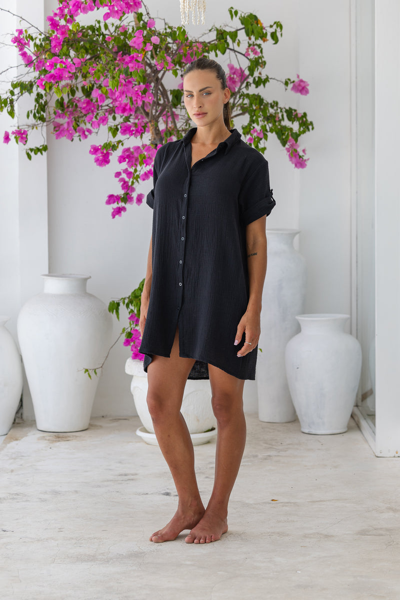 Womens super soft, 100% cotton Riley Shirt Dress in black with button down fastening, side pockets and 3/4 length sleeves with turn-up detail 