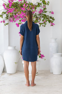 Womens super soft, 100% cotton Riley Shirt Dress in navy blue with button down fastening, side pockets and 3/4 length sleeves with turn-up detail 