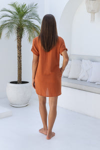 Womens super soft, 100% cotton Shirt Dress in Terracotta with button down fastening, side pockets and 3/4 length sleeves with turn-up detail 