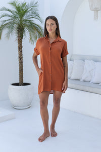 Womens super soft, 100% cotton Shirt Dress in Terracotta with button down fastening, side pockets and 3/4 length sleeves with turn-up detail 
