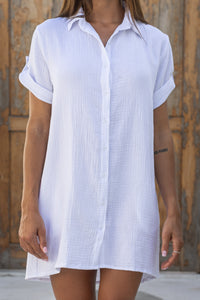 Womens super soft, 100% cotton Riley Shirt Dress in white with button down fastening, side pockets and 3/4 length sleeves with turn-up detail 
