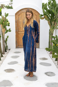 Womens Natalia Maxi Dress in navy and copper tie dye finish, in soft lightweight rayon, with side splits, trumpet sleeves, pockets and hand beaded detailing.