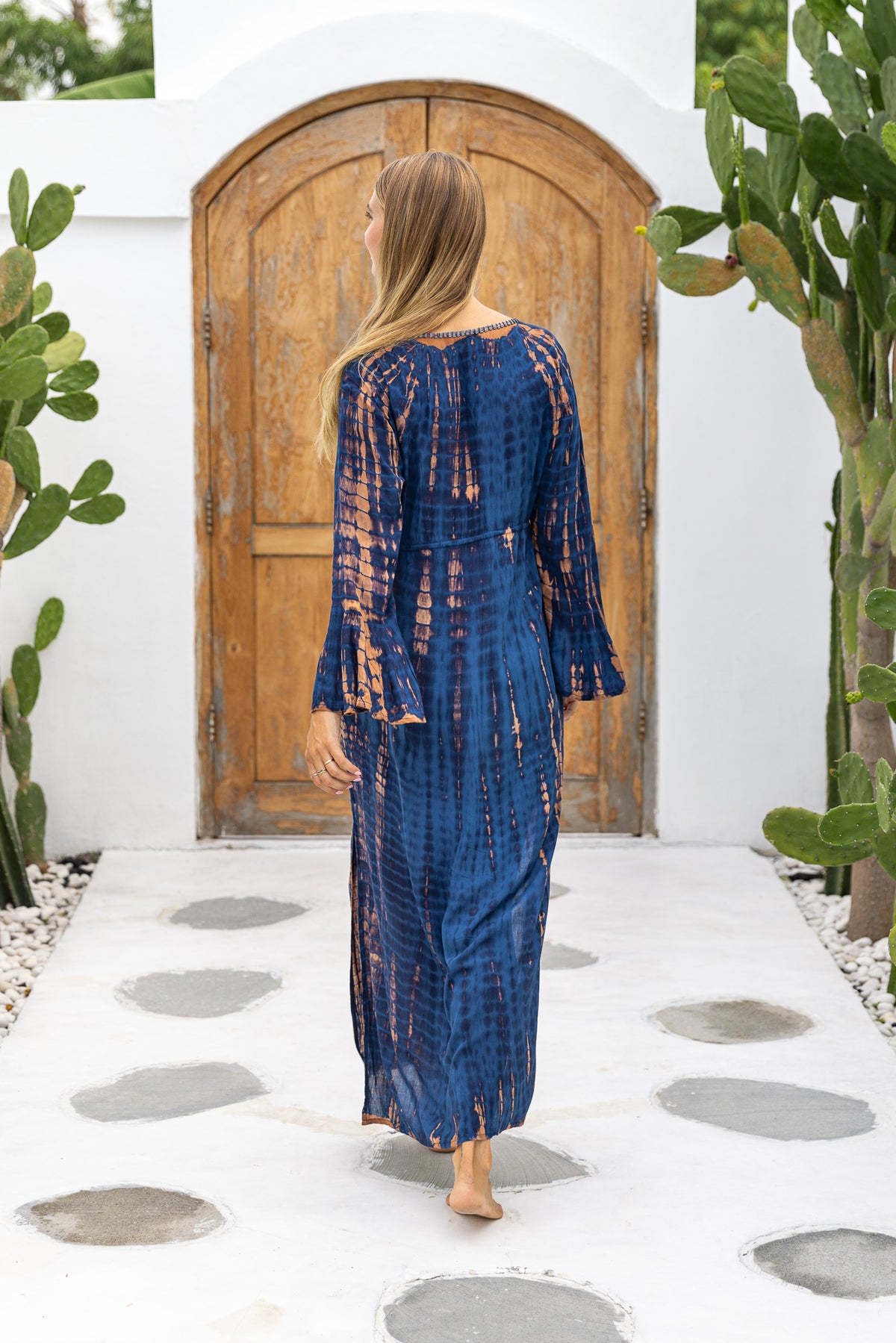 Womens Natalia Maxi Dress in navy and copper tie dye finish, in soft lightweight rayon, with side splits, trumpet sleeves, pockets and hand beaded detailing.