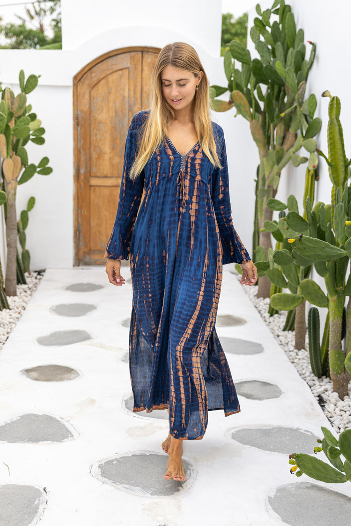 Womens Natalia Maxi Dress in navy and copper tie dye finish, in soft lightweight rayon, with side splits, trumpet sleeves, pockets and hand beaded detailing.