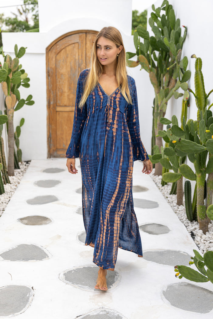 Womens Natalia Maxi Dress in navy and copper tie dye finish, in soft lightweight rayon, with side splits, trumpet sleeves, pockets and hand beaded detailing.