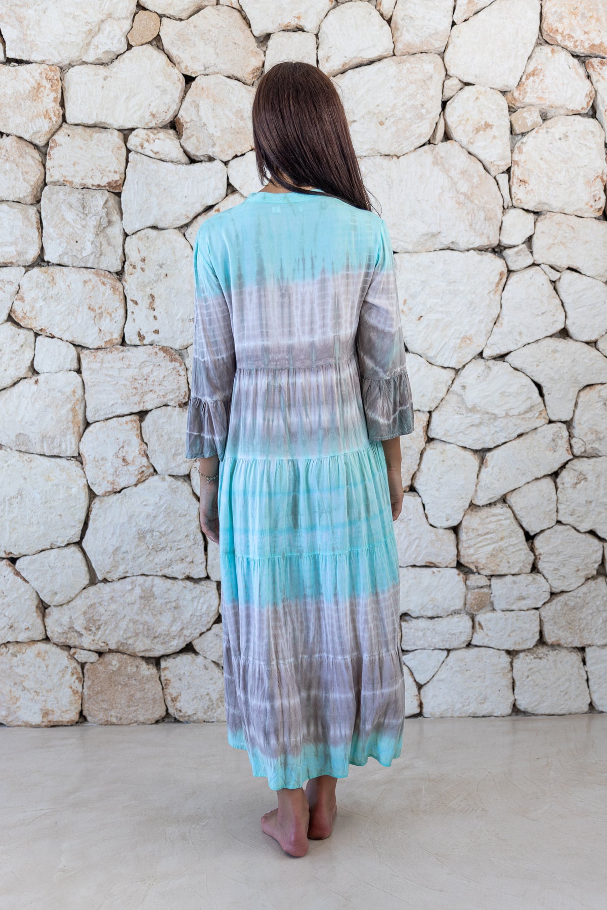 Womens super soft, lightweight, tunic style long length tie dye dress in aqua blue featuring 3/4 length trumpet sleeves and side pockets